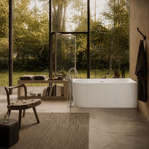 JF Series right corner fluted bathtub by a garden window (AI-generated lifestyle render)